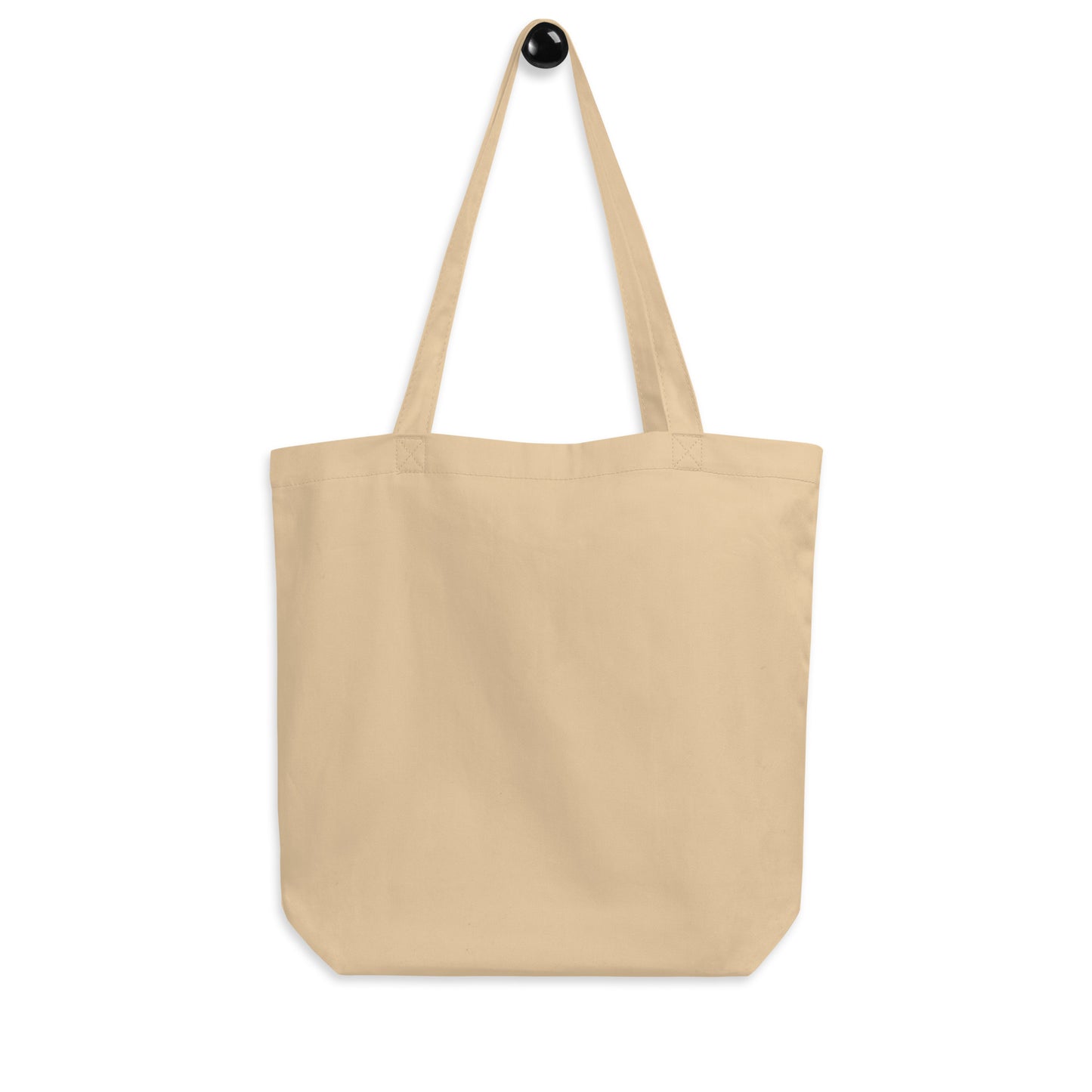 Back view of the Austin eco tote bag, plain without print, showing soft beige color and sturdy construction.