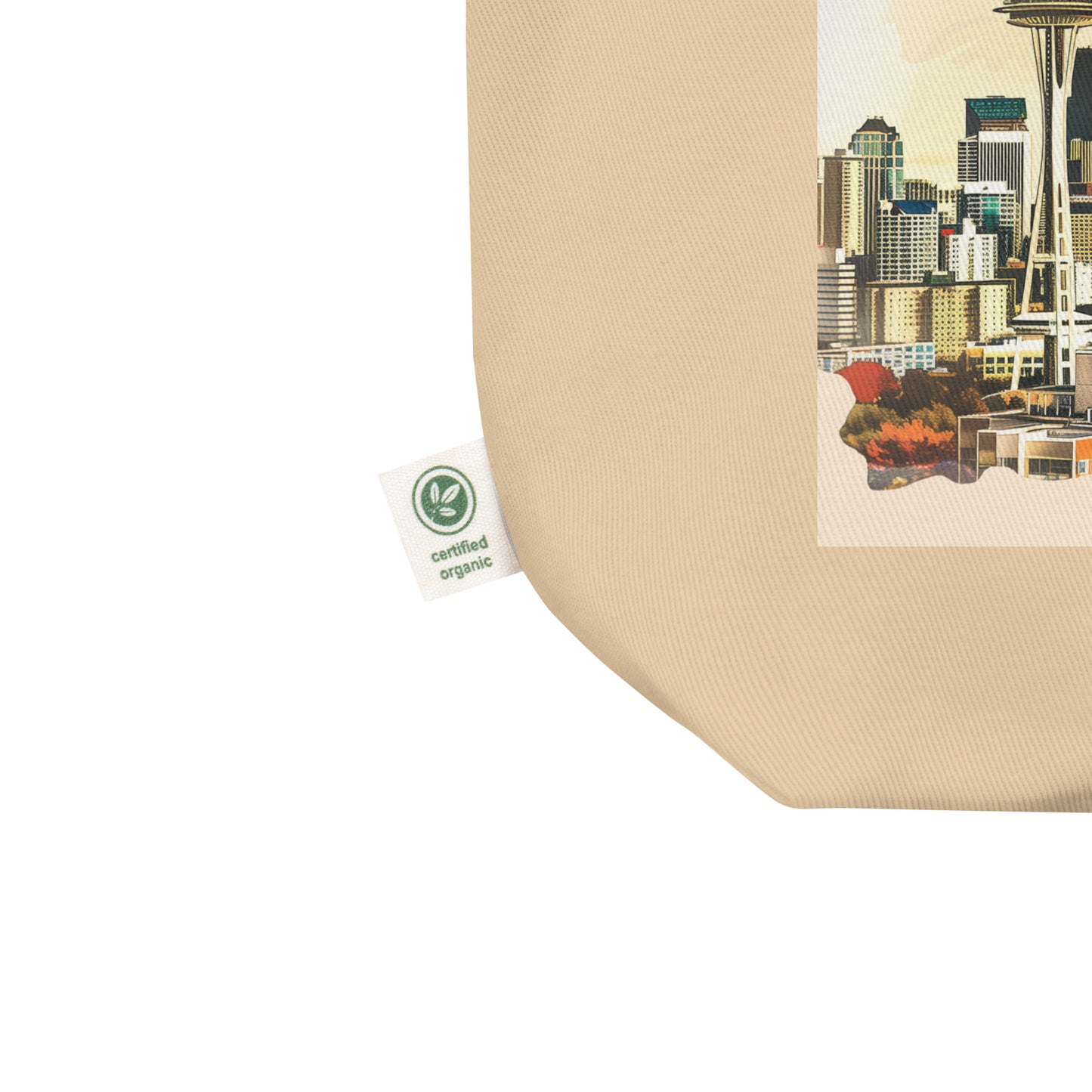 Close-up of the bottom corner of the Seattle tote bag with an organic cotton tag.