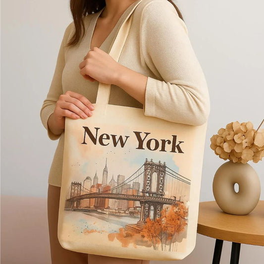 Young woman holding New York tote bag indoors