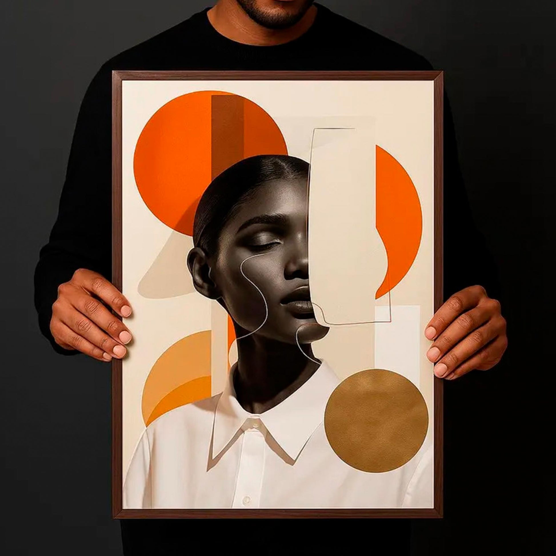 Framed modern abstract portrait held by a man in black shirt, black background, burnt orange and gold tones.