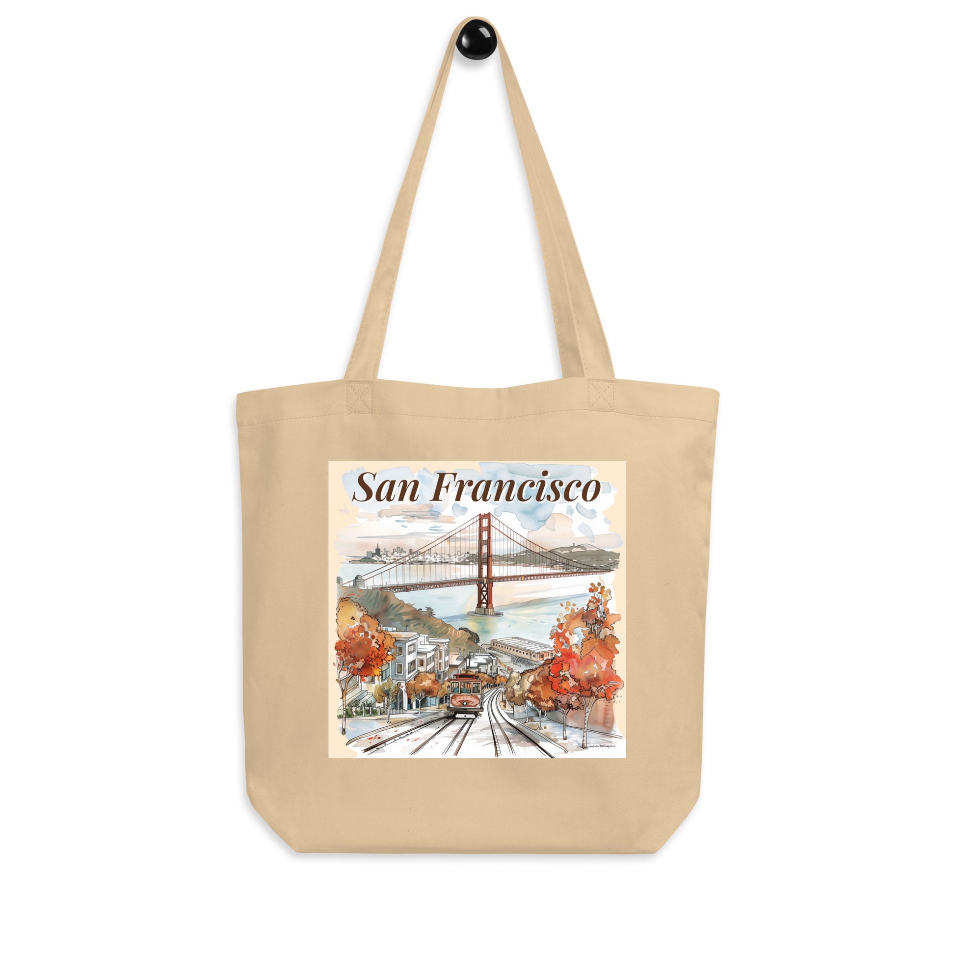 Tote bag with San Francisco design hanging on a black wall hook