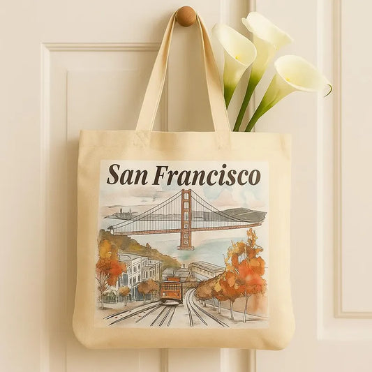 San Francisco tote bag hanging on a door with white calla lilies peeking from inside