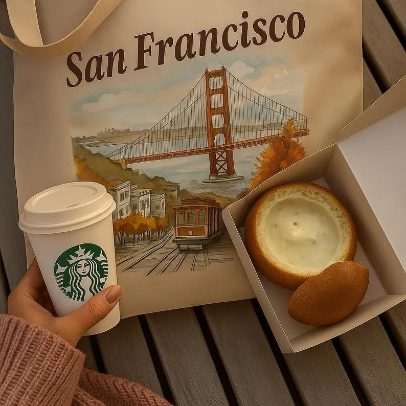 San Francisco tote bag styled with Starbucks coffee cup and traditional clam chowder in a bread bowl